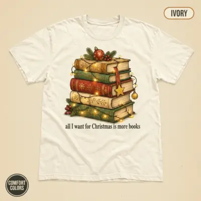 Ivory Comfort Colors garment-dyed t-shirt with All I Want for Christmas Is More Books funny holiday typography graphic, front view