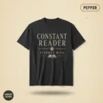 Pepper Comfort Colors t-shirt with "Constant Reader" Stephen King typographic print – front studio view on garment-dyed cotton
