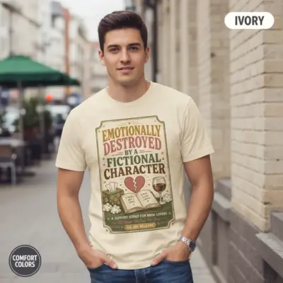 Ivory Comfort Colors garment-dyed tee printed with "Emotionally Damaged by a Fictional Character" typography -- modeled on urban street setting