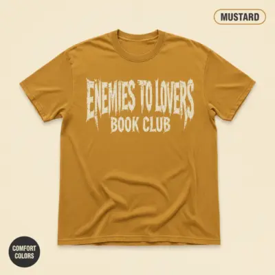 Enemies to lovers romance trope shirt on mustard garment-dyed Comfort Colors 1717 tee, front studio view