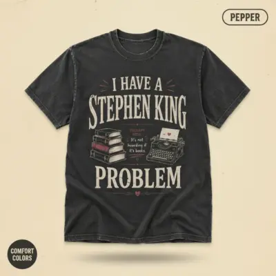 Pepper Comfort Colors garment-dyed tee with bold typographic "I Have a Stephen King Problem" statement print – front chest center, studio flatlay