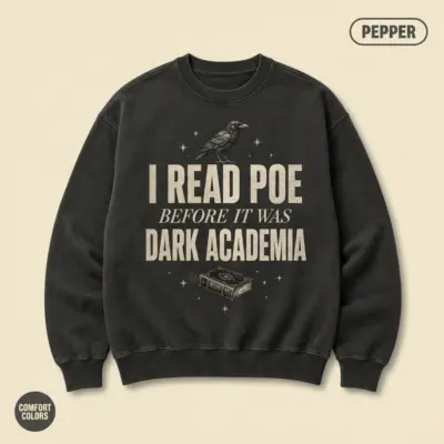 Pepper crewneck sweatshirt with "I Read Poe Before It Was Dark Academia" typographic text printed on front chest -- Comfort Colors 1566 garment-dyed fleece