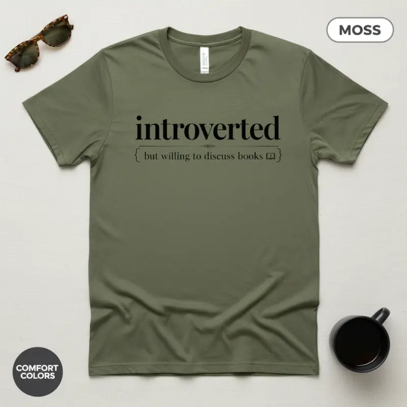 introverted but willing to discuss books bookish garment dyed t shirt funny reader tee flatlay moss