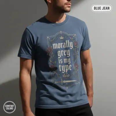 Comfort Colors garment-dyed t-shirt in Blue Jean featuring "Morally Grey Is My Type" typographic dark romance bookish design, worn by male model in creative studio setting
