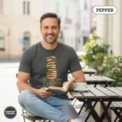 Pepper Comfort Colors garment-dyed t-shirt with "My TBR Pile Is a Lifestyle" bookish humor typography print, worn by mature male model