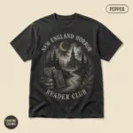 Pepper Comfort Colors t-shirt with Gothic New England Horror Reader typography and atmospheric horror illustration – front view