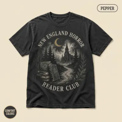 Pepper Comfort Colors t-shirt with Gothic New England Horror Reader typography and atmospheric horror illustration – front view