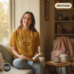 north pole book club christmas bookish gift garment dyed t shirt holiday reader tee reading nook female young mustard