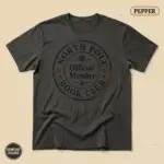 North Pole Book Club Christmas bookish t-shirt in Pepper garment-dyed Comfort Colors 1717 – front studio view with holiday reader graphic