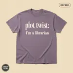 Orchid Comfort Colors garment-dyed t-shirt with bold "Plot Twist: I'm a Librarian" funny typographic graphic printed at front chest center