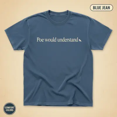 Comfort Colors garment-dyed t-shirt in Blue Jean featuring "Poe Would Understand" gothic typography and Edgar Allan Poe portrait graphic, front chest center