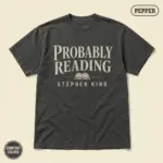 Pepper Comfort Colors t-shirt with "Probably Reading Stephen King" bold typography print -- front view, studio shot