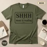 shhh mom is reading funny bookish gift garment dyed t shirt book lover gift for mom flatlay bookish moss