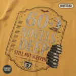 sixty novels deep still not sleeping horror reader t shirt closeup detail mustard