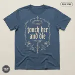 Blue Jean Comfort Colors garment-dyed t-shirt with bold "touch her and die energy" typography print for dark romance readers -- flatlay product view