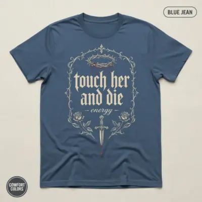 Blue Jean Comfort Colors garment-dyed t-shirt with bold "touch her and die energy" typography print for dark romance readers -- flatlay product view